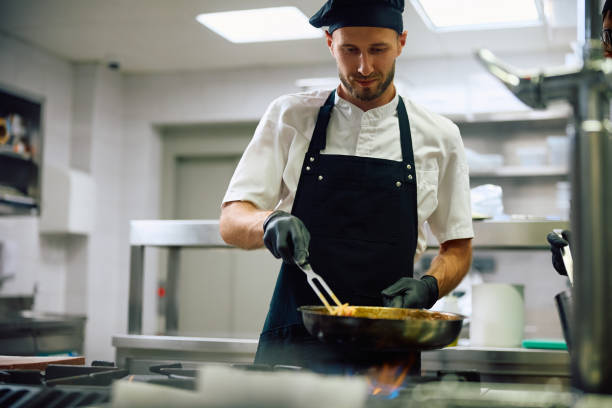 istock Professional cook making pasta in a restaurant. 2156105613