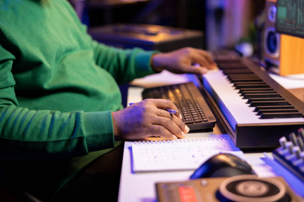 istock songwriter writes down lines and melodic elements to create new tunes 2156107298