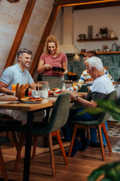 istock A happy family enjoying time together during breakfast 2156107487