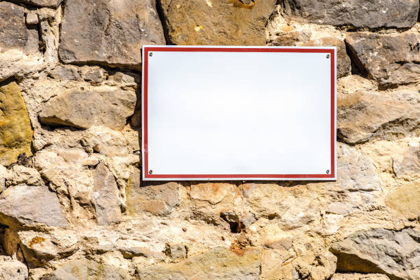 istock Blank sign on a quarry stone wall 2156110886