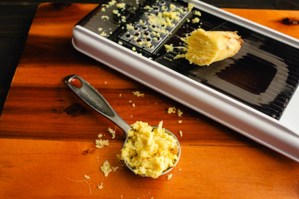 istock Tablespoon of Grated Ginger with a Grater 2156113369