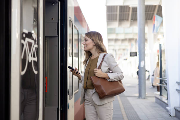 istock Businesswoman getting onto a train 2156113531