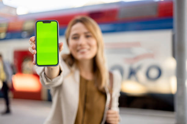 istock A green screen on a cell phone held young woman 2156113563