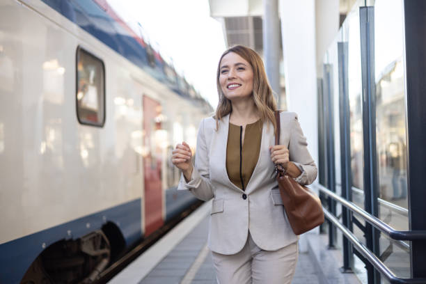 istock Woman waiting on railroad platform 2156113577