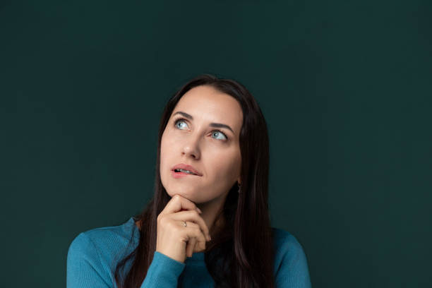 Woman Contemplating With Hand on Chin