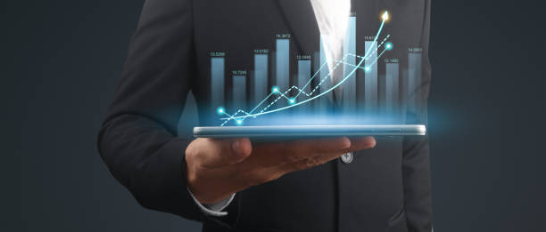 istock Businessman plan graph growth and increase of chart positive indicators,tablet in hand 2156117916