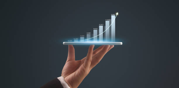 istock Businessman plan graph growth and increase of chart positive indicators,tablet in hand 2156117921