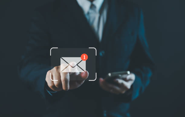 istock New email notification concept for business communication and digital marketing. Inbox receiving electronic message alert. Businessman touch email icon on virtual screen. online internet technology 2156118877