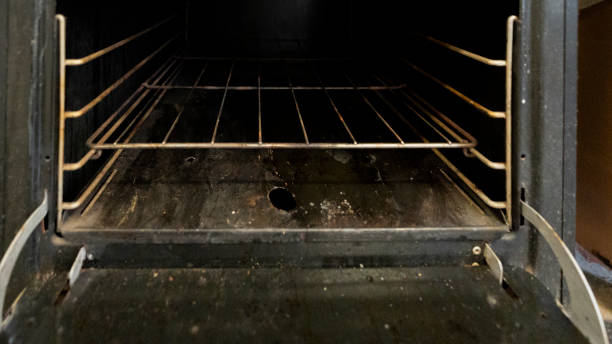 istock Rusty, dirty and old black and white antique stove 2156119502