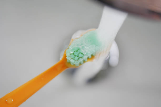 An Old worn out toothbrush with bent bristles
