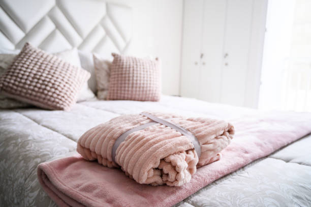 istock Cozy bedroom with soft bedding and plush pillows 2156125866