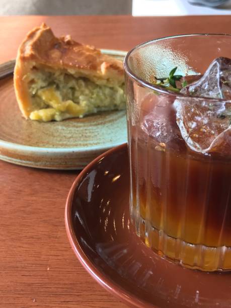 istock Iced coffee and slice of pie on cafe table 2156125984