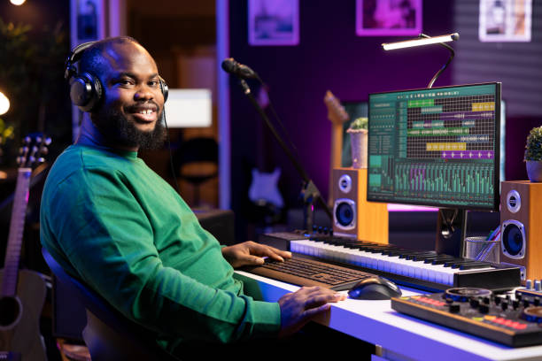 istock Portrait of sound engineer working on producing music in home studio 2156127088