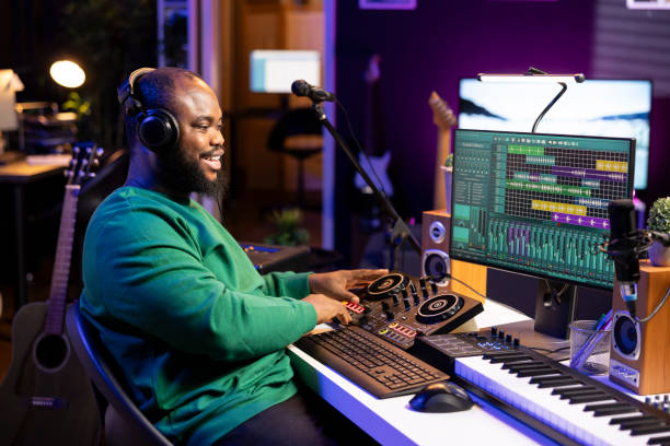 istock Young musician twisting knobs and mixing tunes with a console 2156127795