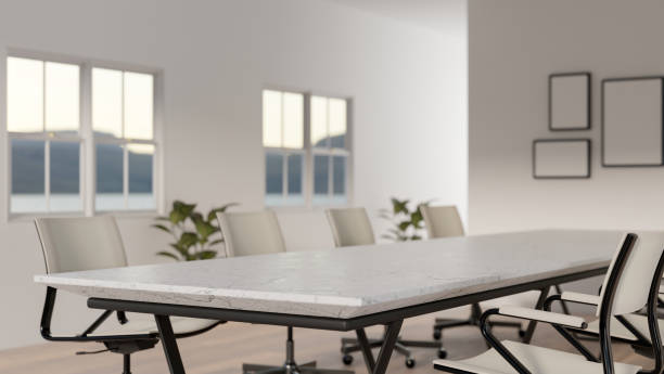 istock A minimalist white meeting room features a white marble meeting table and white armchairs. 2156128665