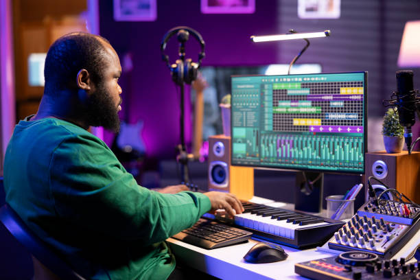 istock Sound engineer recording piano notes with DAW software in his home studio 2156128807