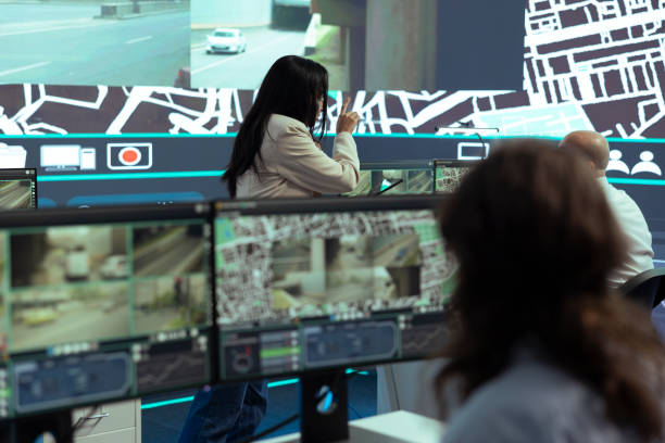 istock Indian team leader instructs her staff to help couriers with gps coordinates 2156129071