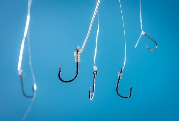 istock Fishing hook on blue background,Angling equipment 2156129289