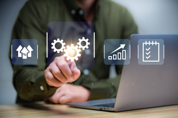 istock Business Automation and Artificial intelligence for business concept . Man using tablet and touch business automation software to optimise business process workflow. 2156132300
