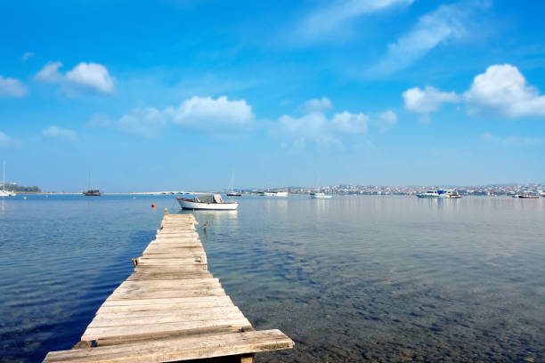 istock Small wooden boat dock in Mediterranean seaside town 2156132380