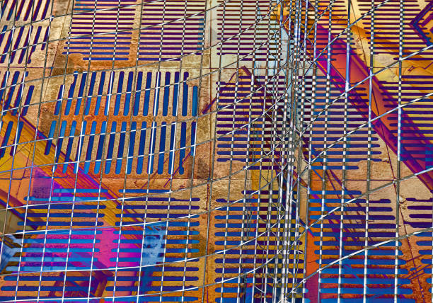 rusty metal grate and glass office building facade. multi exposed image.