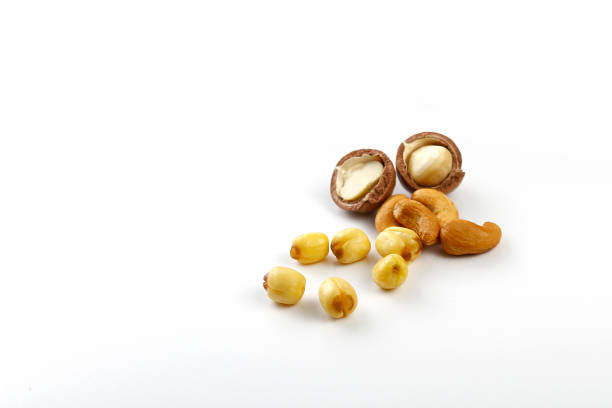 istock Lotus seeds macadamia cashew snack food on white background. High angle view mixed bean nuts 2156134279