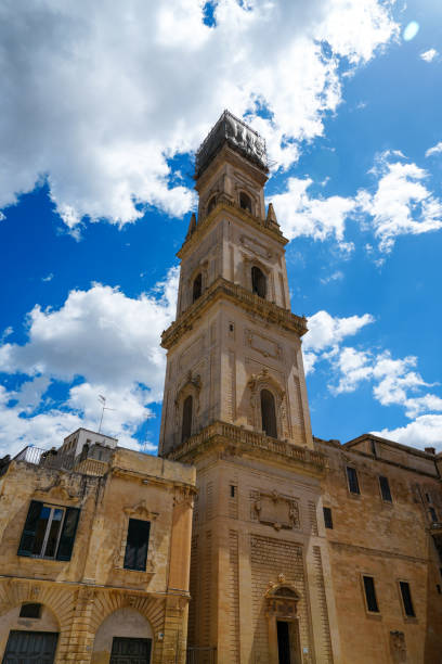 Skyward view of the golden colored bell tower of the cathedral in Lecce Italy