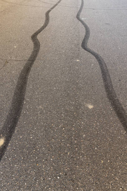 istock tire tracks during dangerous driving on the road 2156135987
