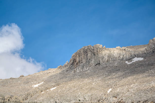 istock Rocky hill with clouds visible in the background on a sunny day 2156142573