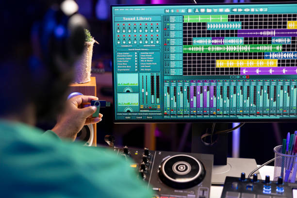 istock Artist composing new music with an usb stick in his home studio 2156143939