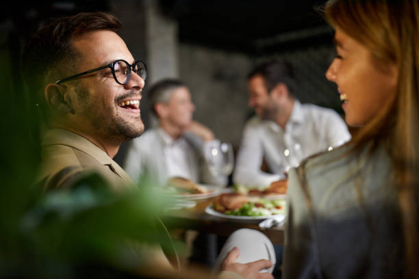 istock Happy business couple talking on a lunch in a restaurant. 2156144857