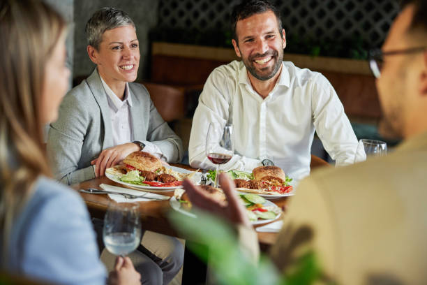 istock Cheerful business team having lunch in a restaurant. 2156145568