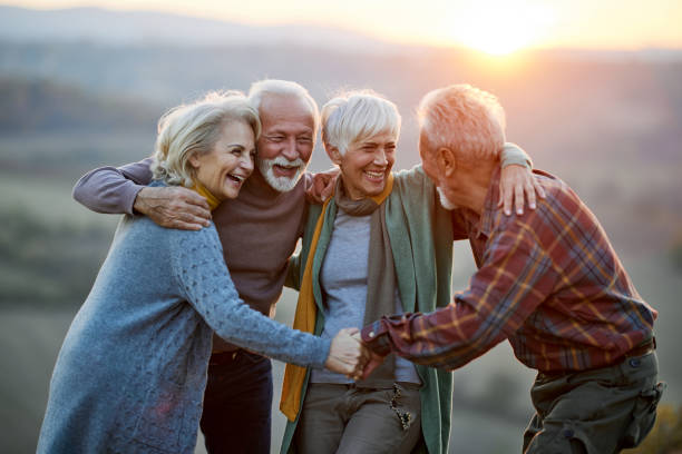 istock Happy embraced friends talking in nature at sunset. 2156145572