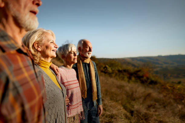 istock Mature friends looking at view from a hill. 2156145667