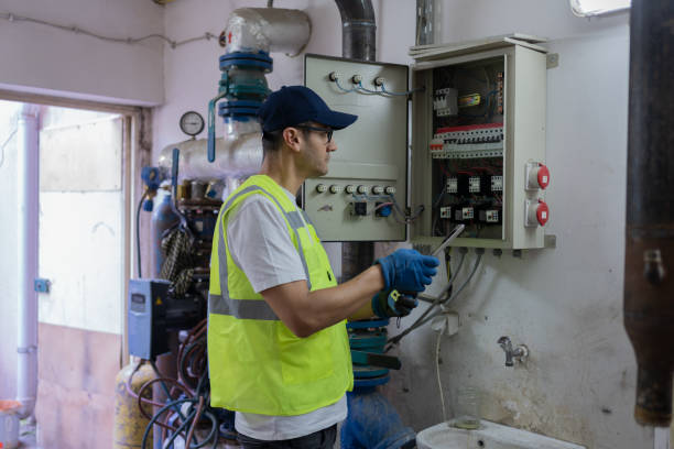 istock Electrician Checking For Voltage In A Fuse Box 2156146450