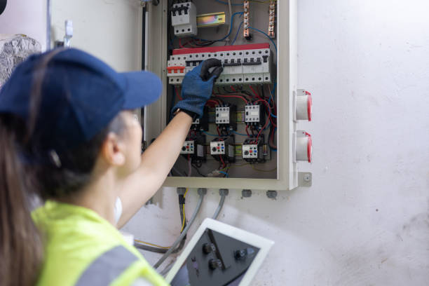 istock Electrician Checking For Voltage In A Fuse Box 2156146531