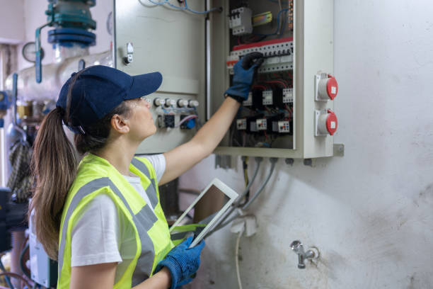 istock Electrician Checking For Voltage In A Fuse Box 2156146948