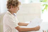 child-holding-school-test-with-excellent-a-grade.jpg?b=1&s=170x170&k=20&c=Ot-duEk7Jlhs86j39XZlrvBA8zmxg5JqZI3TlGZAUAU=