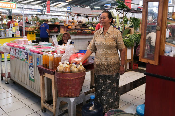 Woman selling traditional herbal medicine at a market in Tangerang, Indonesia-Southeast Asia, on May 14, 2024