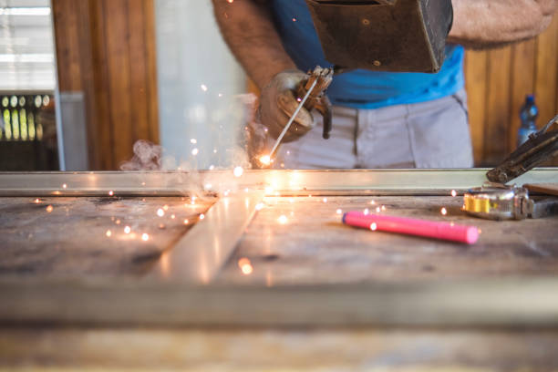 Senior man working on his DIY project independently due to many years of experience