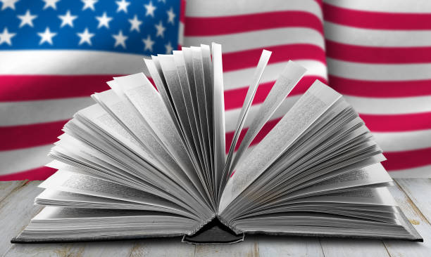Open Book Against a Blurred American Flag Background
