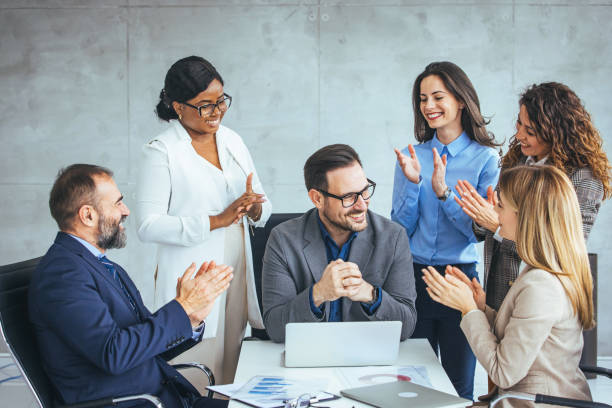 istock Multicultural Team Applauding Colleague During Meeting 2156153872