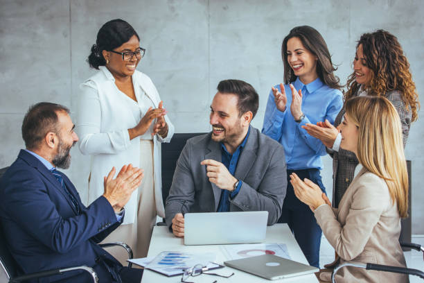 istock Multicultural Team Celebrating Businessman's Success 2156153896