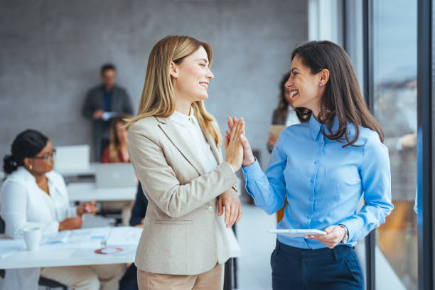 istock Engaged Caucasian Businesswomen Collaborating in Office 2156153962