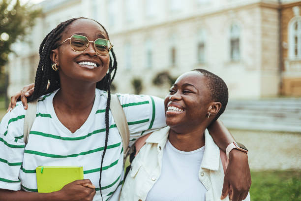 istock Smiling Black Female College Students Outdoors 2156154088
