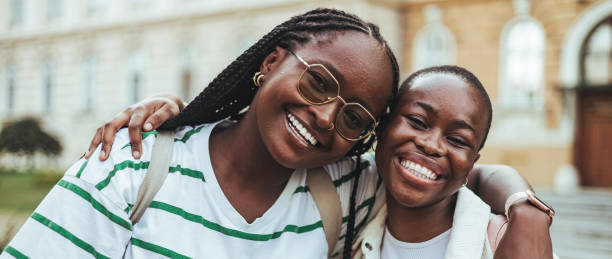 Smiling Black Female Students Enjoying Campus Life