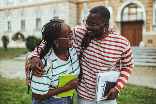 istock Joyful Black College Students Embracing on Campus 2156154114