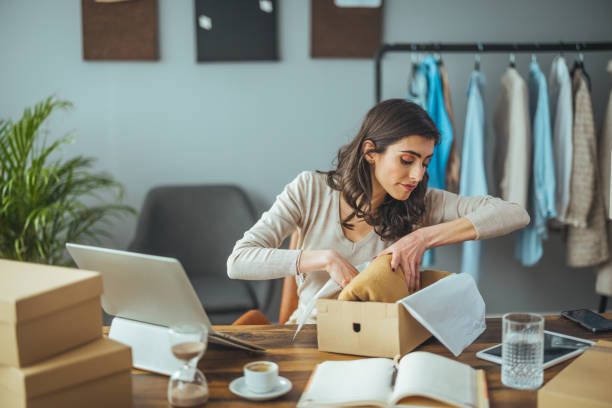 istock Joyful Entrepreneur Organizing Orders in Home Office 2156154510