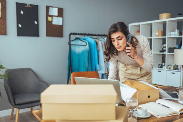 istock Smiling Entrepreneur Preparing Orders in Home Office 2156154586