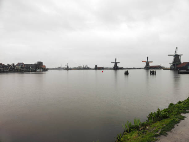 famous Zaanse Schans village in Netherlands with beautiful green windmills